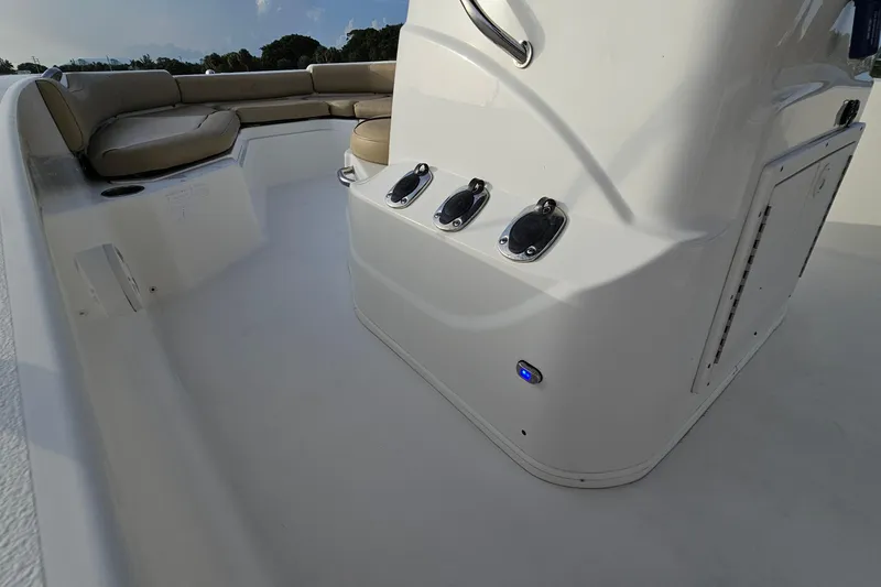 Slide: The Image of 2021 NauticStar 191 Hybrid boat interior with seating and control panel. - 35