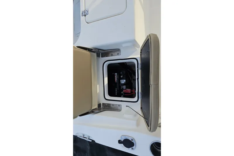 Slide: The Image of 2021 NauticStar 191 Hybrid boat battery compartment with open hatch. - 37