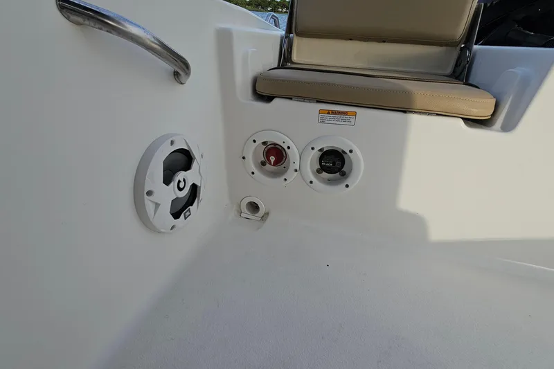 Slide: The Image of 2021 NauticStar 191 Hybrid boat interior with speaker and control panel. - 38