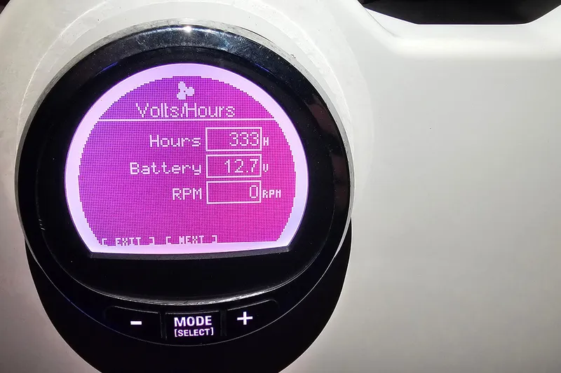 Slide: The Image of Digital display on 2021 NauticStar 191 Hybrid showing hours, battery voltage, and RPM. - 46
