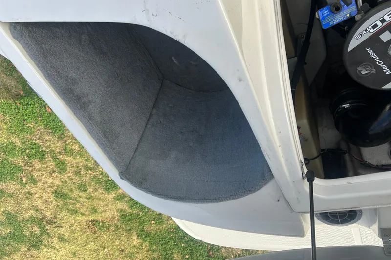 Slide: The Image of 2008 Sea Ray 175 Bow Rider engine compartment with MerCruiser engine, open hatch view. - 15