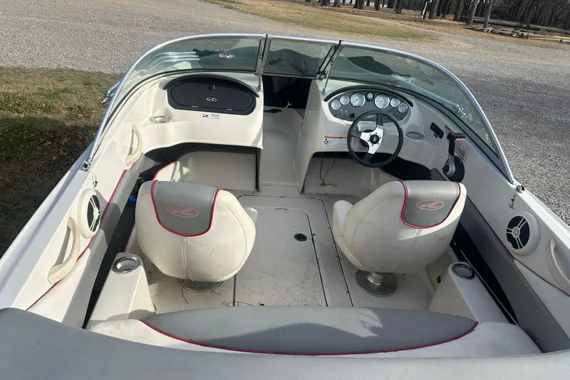 Slide: The Image of 2008 Sea Ray 175 Bow Rider interior with steering wheel and seating. - 5