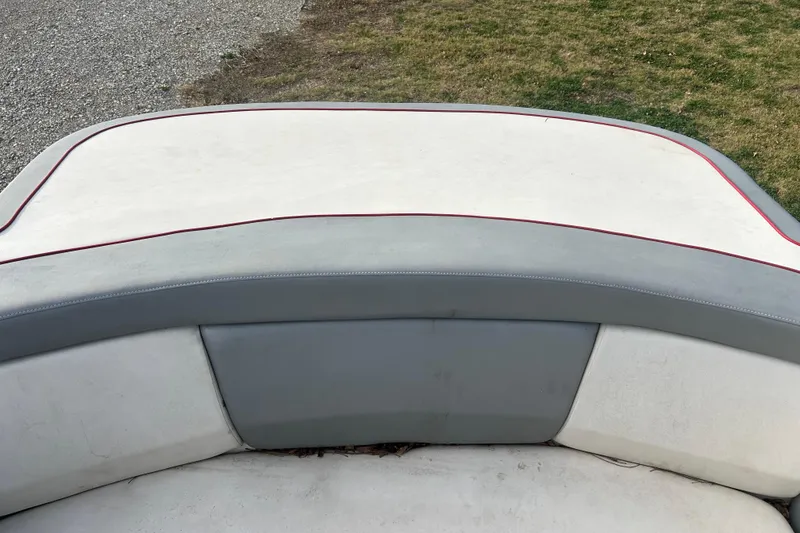 Slide: The Image of 2008 Sea Ray 175 Bow Rider boat seating with gray and white upholstery. - 6