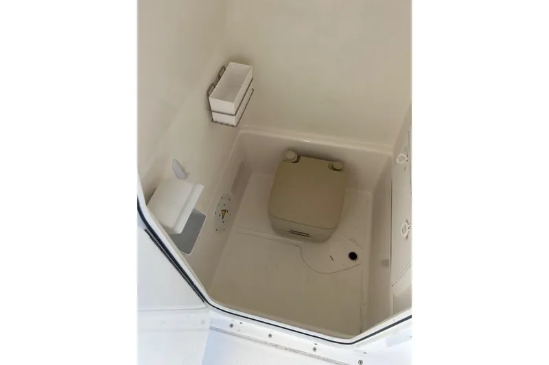 Slide: The Image of Compact marine toilet in 2005 Edgewater 245CC boat cabin. - 10