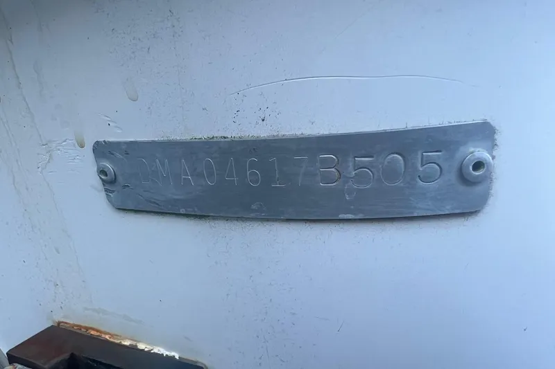Slide: The Image of 2005 Edgewater 245CC boat hull identification number plate, DMA04617B505. - 14