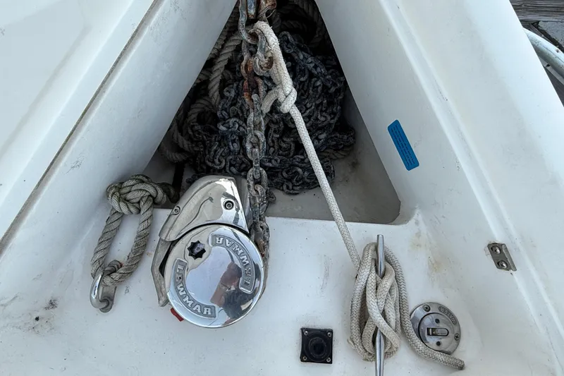 Slide: The Image of Anchor locker of 2007 Hunter 31 sailboat with ropes and chain. - 11