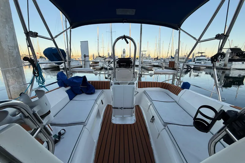 Slide: The Image of 2007 Hunter 31 sailboat interior with seating, docked in marina. - 14