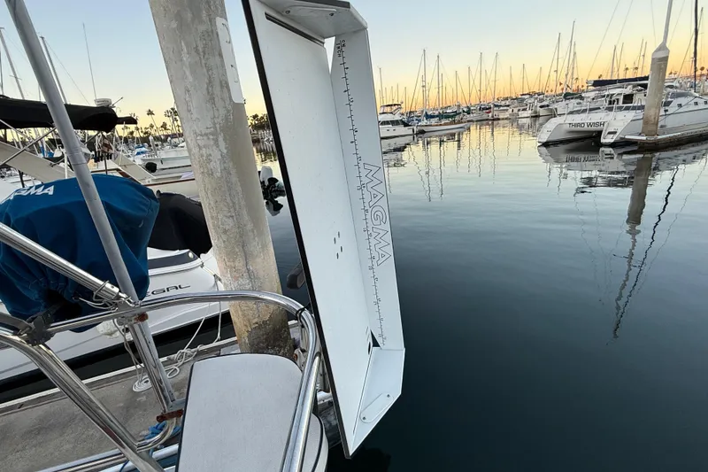 Slide: The Image of Marina with Hunter 31 sailboat, 2007 model, docked at sunset with calm waters. - 16