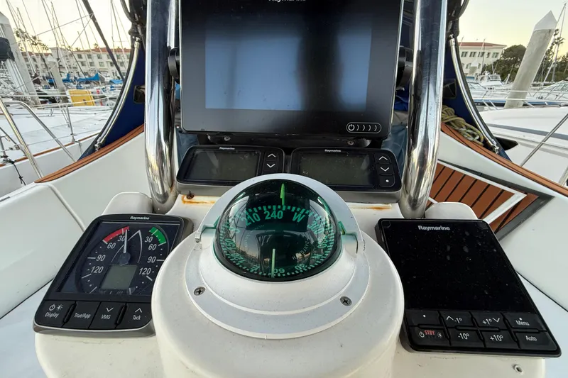 Slide: The Image of Cockpit of 2007 Hunter 31 sailboat with navigation instruments and compass. - 18