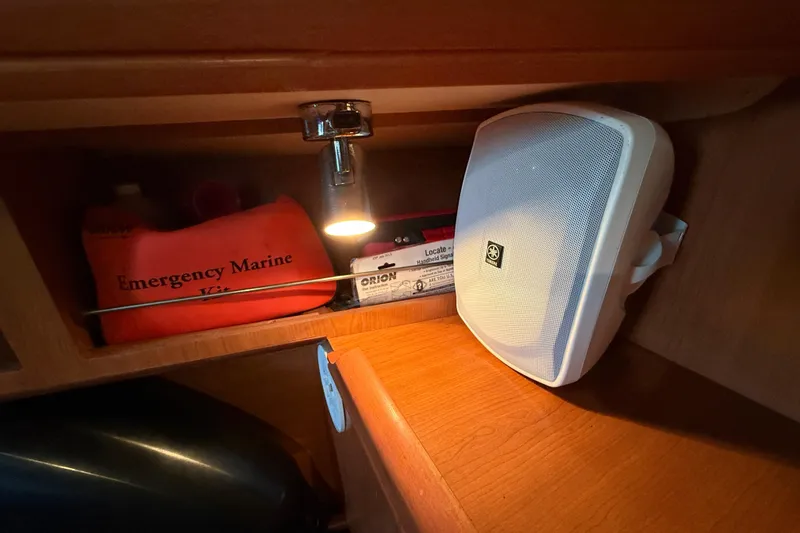Slide: The Image of 2007 Hunter 31 interior with emergency marine kit and speaker. - 27