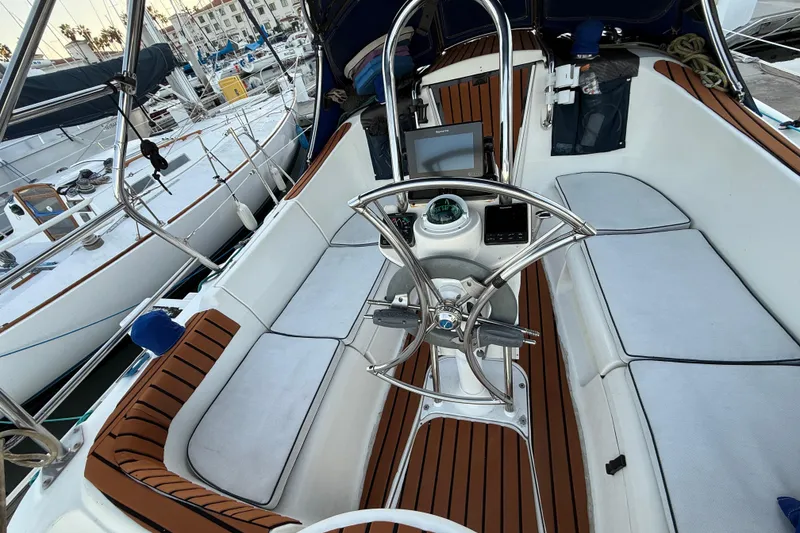Slide: The Image of Cockpit of 2007 Hunter 31 sailboat with steering wheel and navigation equipment. - 6