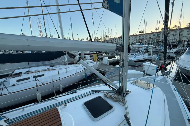 Slide: The Image of Sailboats docked at marina, featuring a 2007 Hunter 31 model. - 8