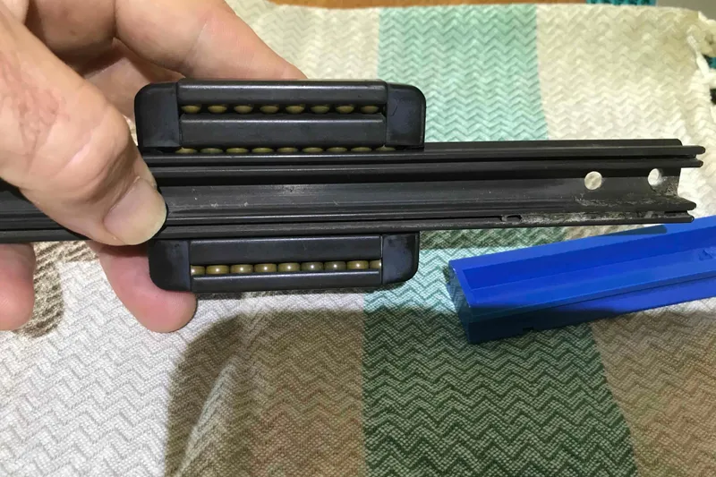 Slide: The Image of Close-up of a Catalina 320 sailboat mast with Harken hardware, 1995 model. - 114