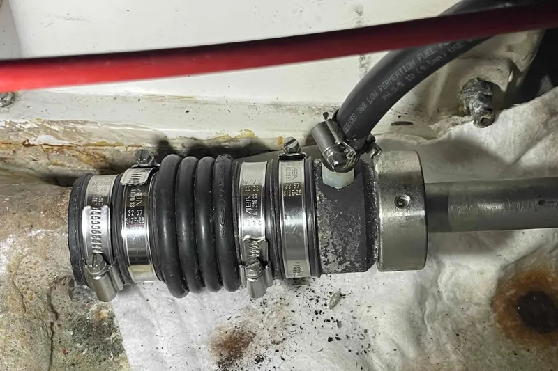 Slide: The Image of Person in protective gear working on Catalina 320 boat hull maintenance. - 35