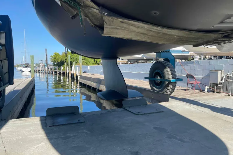 Slide: The Image of Catalina 320 sailboat in dry dock, undergoing maintenance. - 45