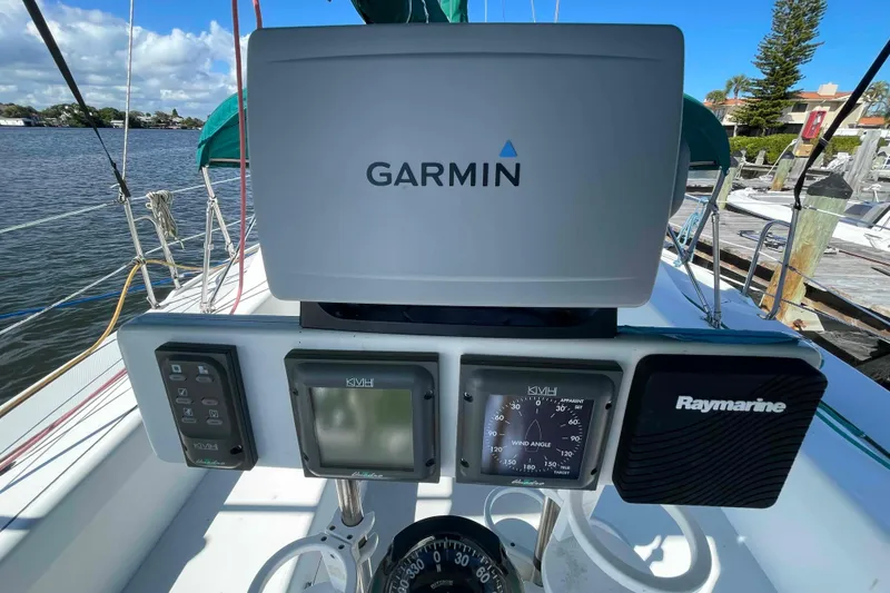 Slide: The Image of Sailboat deck of Catalina 320 with stainless steel railings over water. - 57
