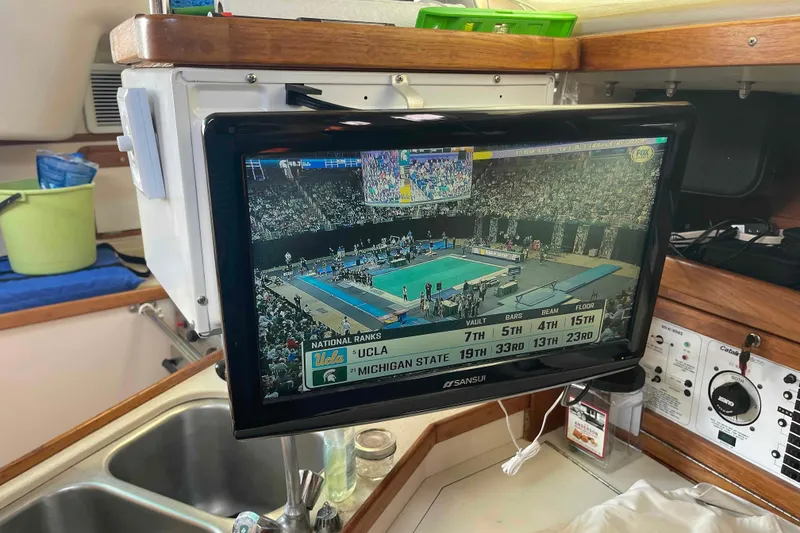 Slide: The Image of Television Catalina 320 yacht showing UCLA vs. Michigan State gymnastics event. - 98