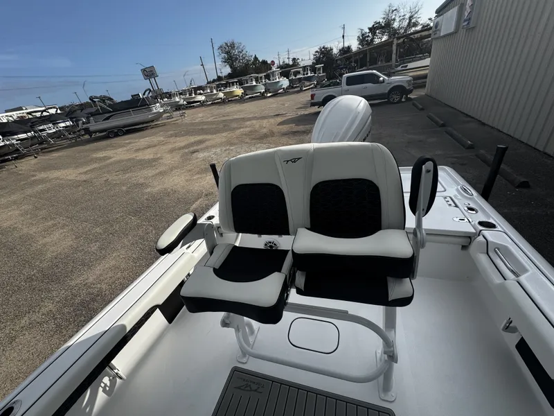 Slide: The Image of 2026 Tidewater 2500 Carolina Bay with dual seating outdoors. - 16