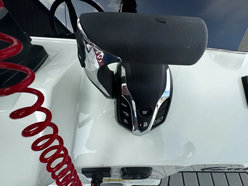Slide: The Image of Throttle control of 2026 Tidewater 2500 Carolina Bay with red coiled safety cord. - 18