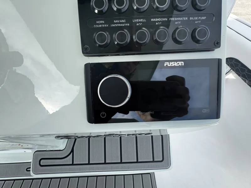 Slide: The Image of Control panel of Tidewater 2500 Carolina Bay 2026 with Fusion stereo. - 19