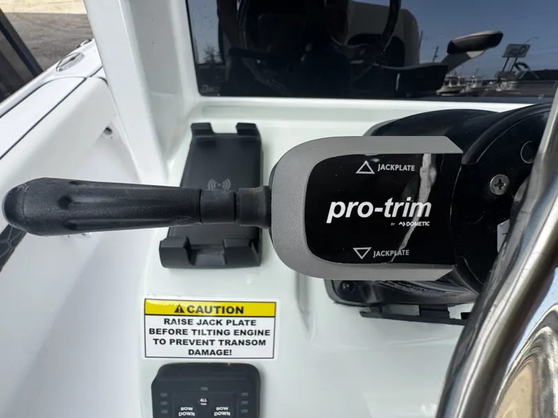 Slide: The Image of Close-up of Pro-Trim lever on a 2026 Tidewater 2500 Carolina Bay. - 22