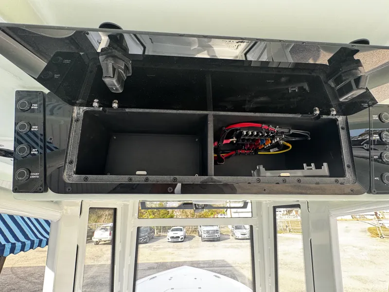 Slide: The Image of Electrical compartment of 2026 Tidewater 2500 Carolina Bay boat. - 27