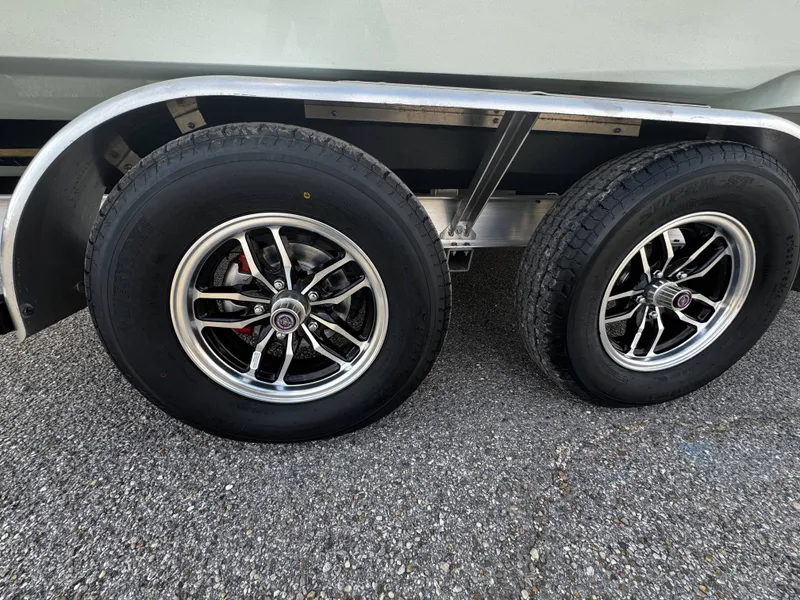 Slide: The Image of Close-up of trailer wheels for Tidewater 2500 Carolina Bay 2026. - 7
