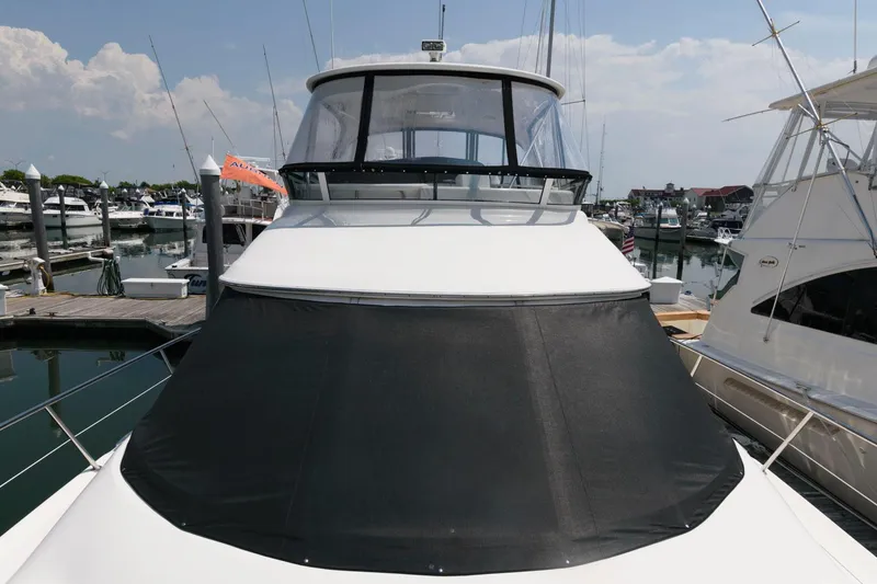 Slide: The Image of 2004 Sea Ray 480 Sedan Bridge yacht docked at marina. - 13
