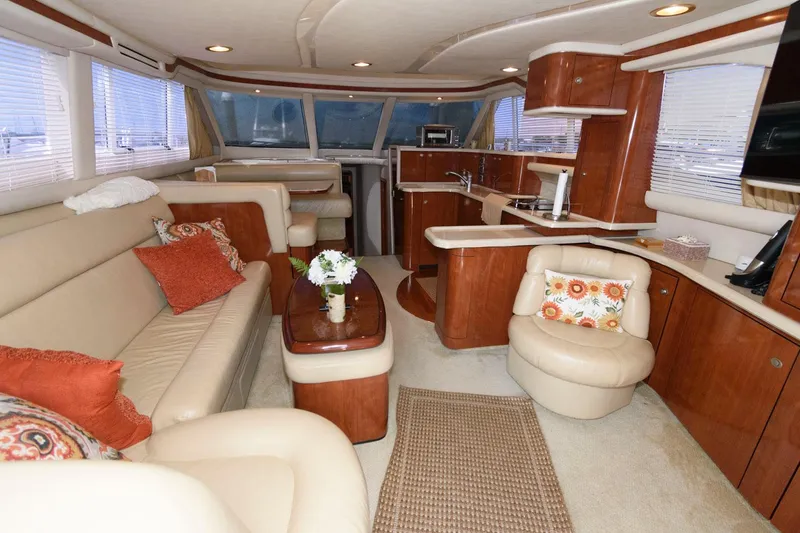 Slide: The Image of Luxurious interior of 2004 Sea Ray 480 Sedan Bridge yacht with elegant seating and decor. - 16