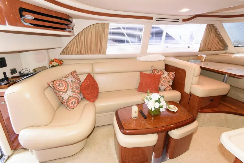Slide: The Image of Luxurious interior of 2004 Sea Ray 480 Sedan Bridge with elegant seating and decor. - 17