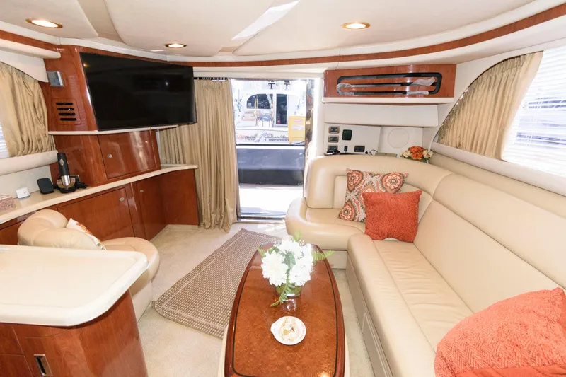 Slide: The Image of Luxurious interior of 2004 Sea Ray 480 Sedan Bridge yacht with elegant seating and decor. - 19