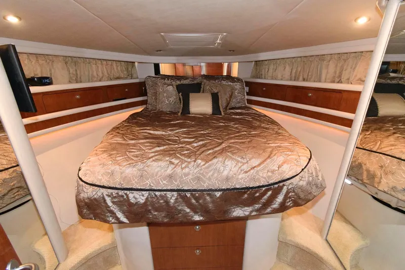 Slide: The Image of Luxurious bedroom interior of 2004 Sea Ray 480 Sedan Bridge yacht. - 23