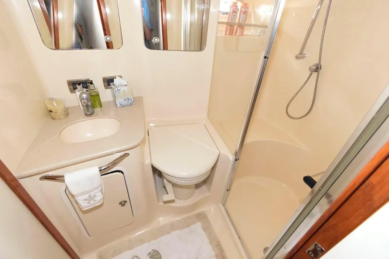 Slide: The Image of Luxurious bathroom in 2004 Sea Ray 480 Sedan Bridge yacht with shower and vanity. - 25