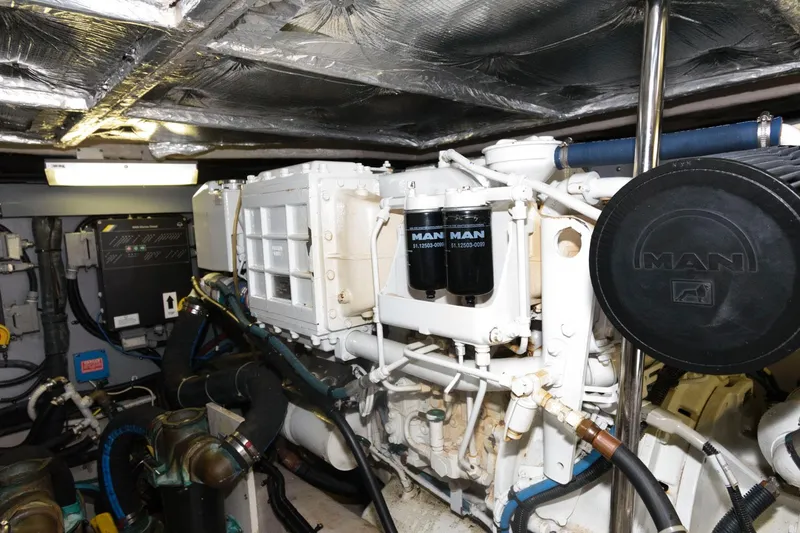 Slide: The Image of Engine room of 2004 Sea Ray 480 Sedan Bridge with MAN diesel engine components. - 30