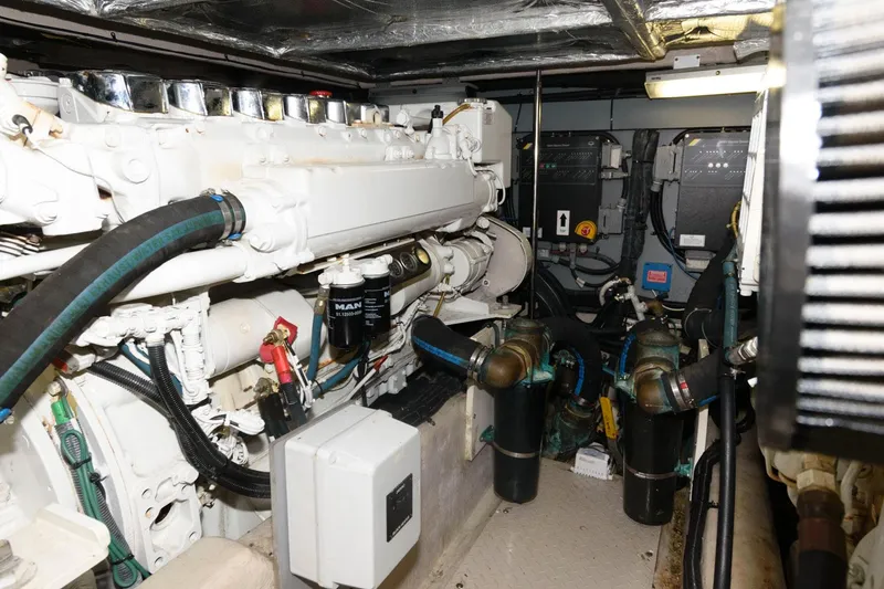 Slide: The Image of Engine room of 2004 Sea Ray 480 Sedan Bridge yacht, showcasing mechanical components. - 31