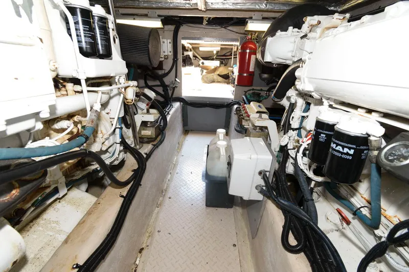 Slide: The Image of Engine room of 2004 Sea Ray 480 Sedan Bridge yacht, showcasing machinery and equipment. - 32