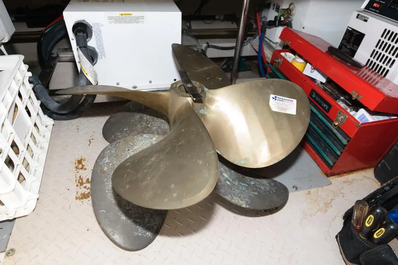 Slide: The Image of Propeller of a 2004 Sea Ray 480 Sedan Bridge in a workshop setting. - 34