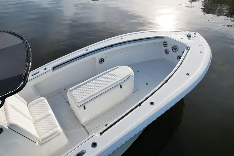 Slide: The Image of 2009 Yellowfin 36 Offshore boat with spacious seating and sleek design on calm water. - 18