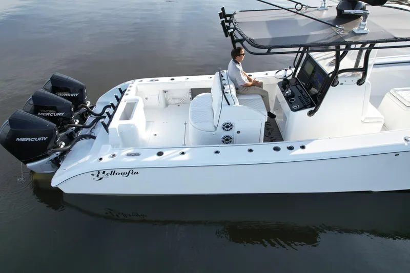 Slide: The Image of 2009 Yellowfin 36 Offshore boat with triple Mercury engines on calm water. - 20