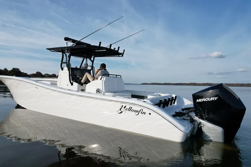 Slide: The Image of 2009 Yellowfin 36 Offshore boat with Mercury engine on calm water. - 9