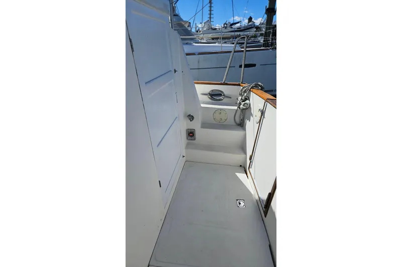 Slide: The Image of 1984 Albin Palm Beach 37 boat deck with white interior and wooden accents. - 13
