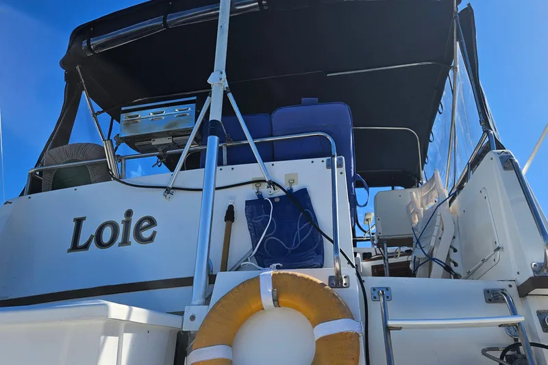 Slide: The Image of 1984 Albin Palm Beach 37 boat stern with canopy, grill, and life preserver. - 14