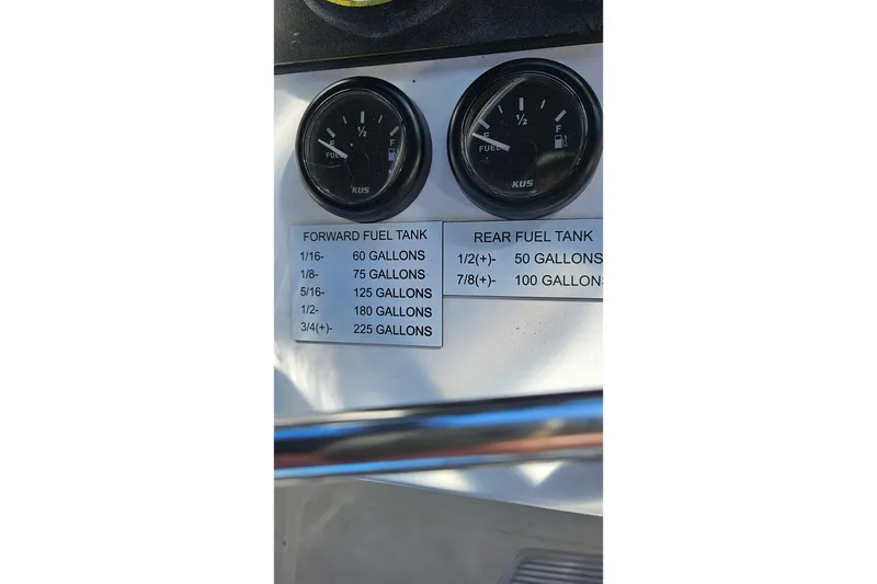 Slide: The Image of Fuel gauges and capacity chart on 1984 Albin Palm Beach 37 boat dashboard. - 20