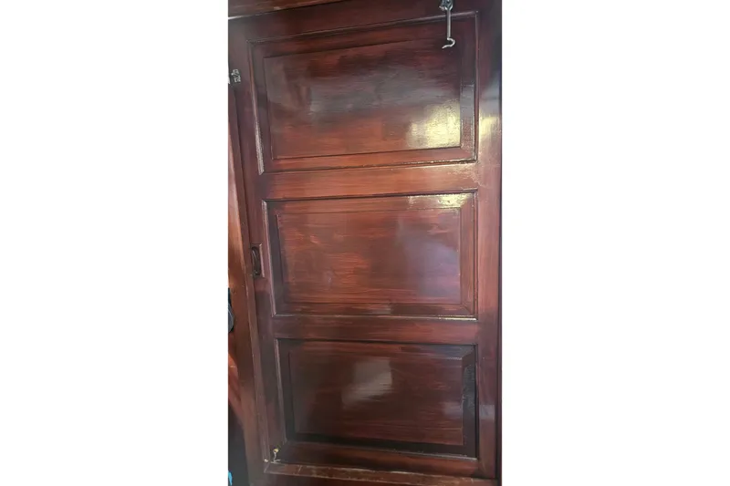 Slide: The Image of Polished wooden door on 1984 Albin Palm Beach 37 boat interior. - 29