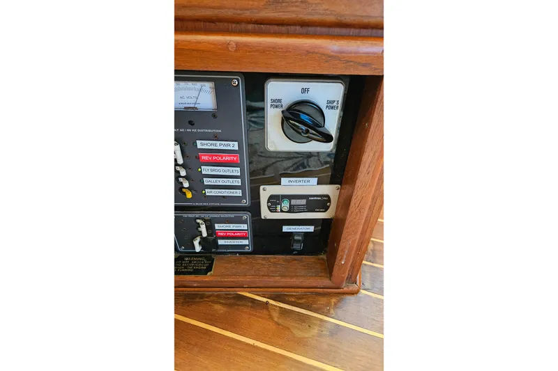 Slide: The Image of Electrical control panel on 1984 Albin Palm Beach 37 boat, featuring switches and indicators. - 45