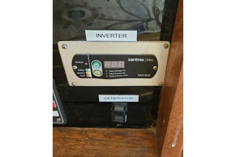 Slide: The Image of Xantrex inverter and generator switch on 1984 Albin Palm Beach 37 boat. - 46