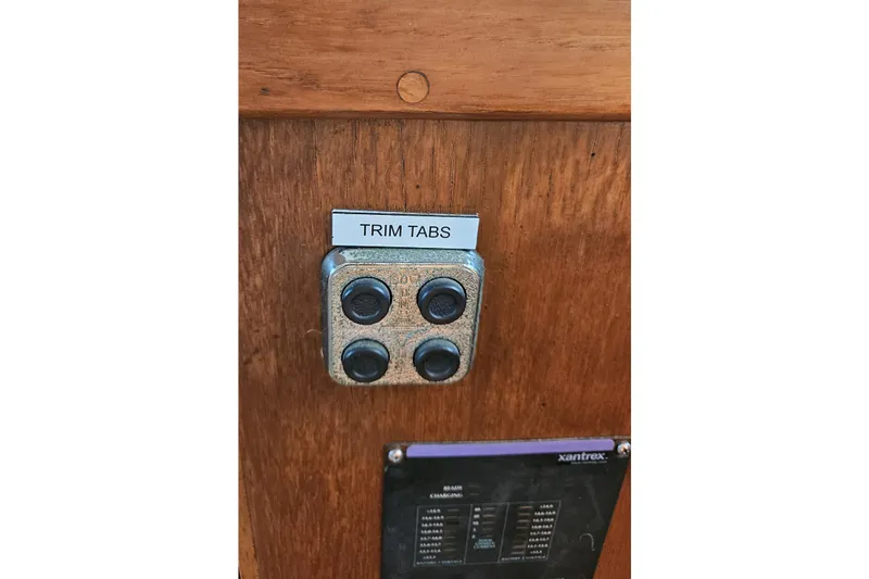 Slide: The Image of Control panel for trim tabs on 1984 Albin Palm Beach 37 boat. - 48