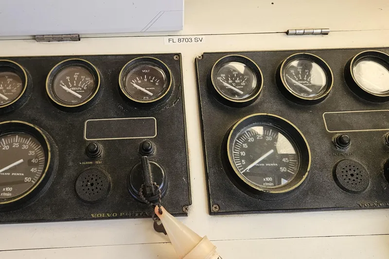 Slide: The Image of Control panel of a 1984 Albin Palm Beach 37 boat with Volvo Penta gauges. - 49