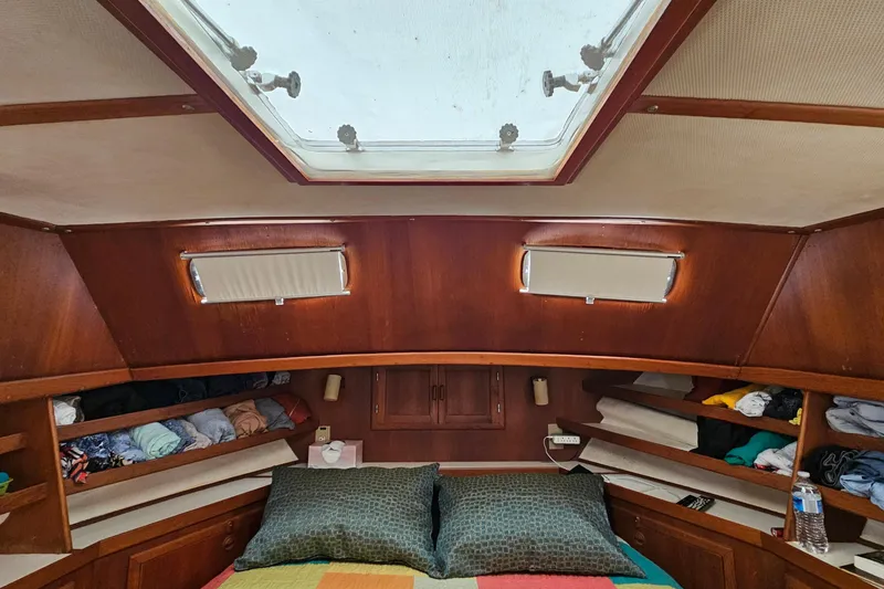 Slide: The Image of Cozy cabin interior of 1984 Albin Palm Beach 37 with skylight and wooden shelves. - 57