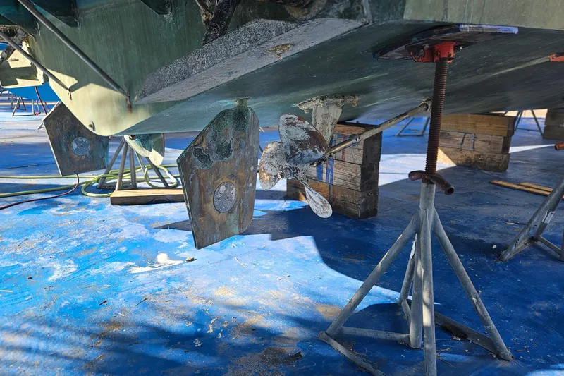 Slide: The Image of 1984 Albin Palm Beach 37 boat hull and propeller on stands in dry dock. - 62